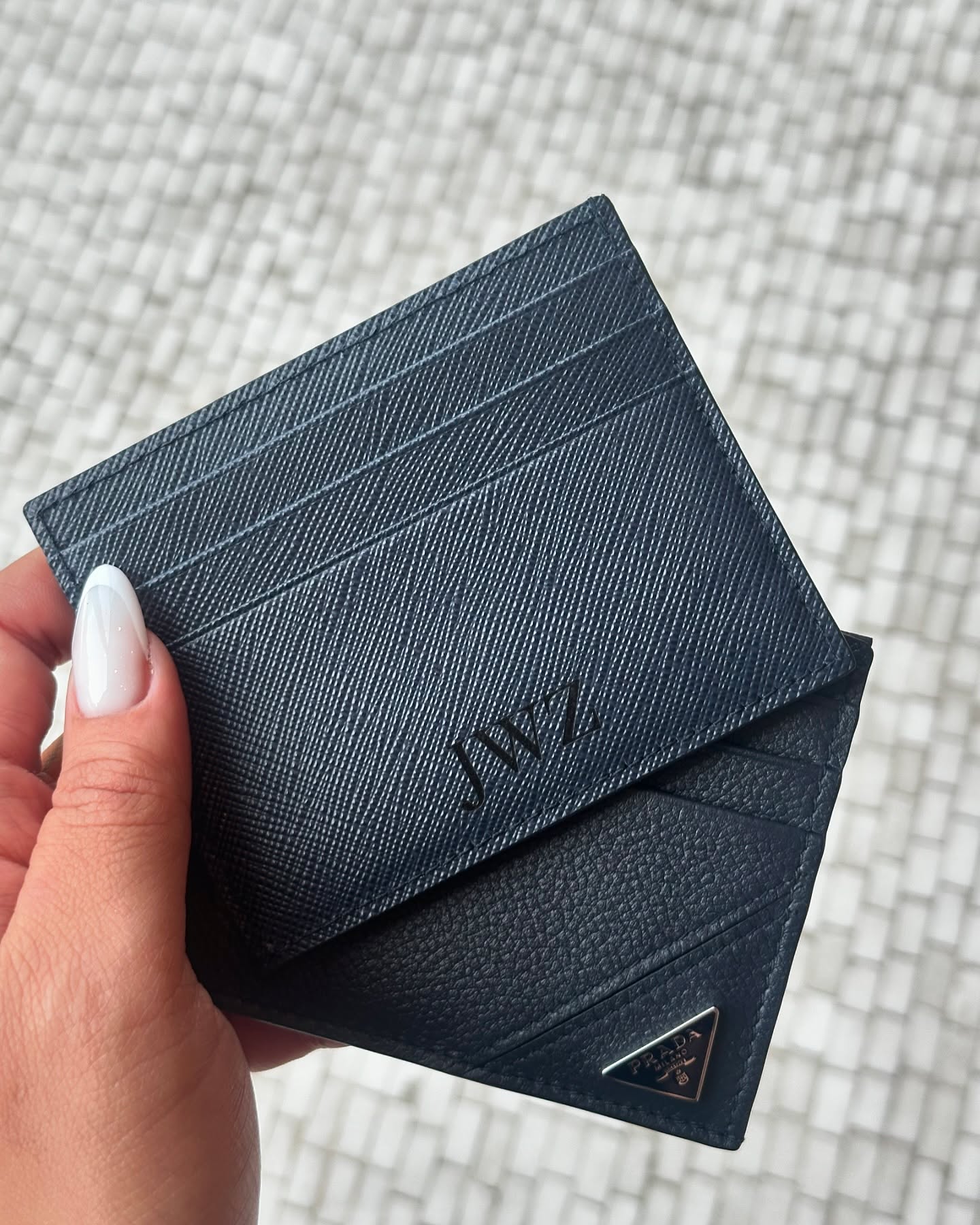 Engraved Prada cardholders — close-up of in-house engraving detail